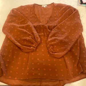 Burnt orange flowy top from Chic Soul. Size XL.